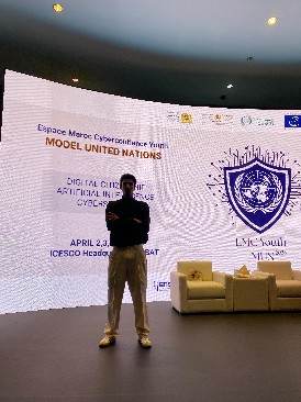Abdelwahed speaking on a Model United Nations stage